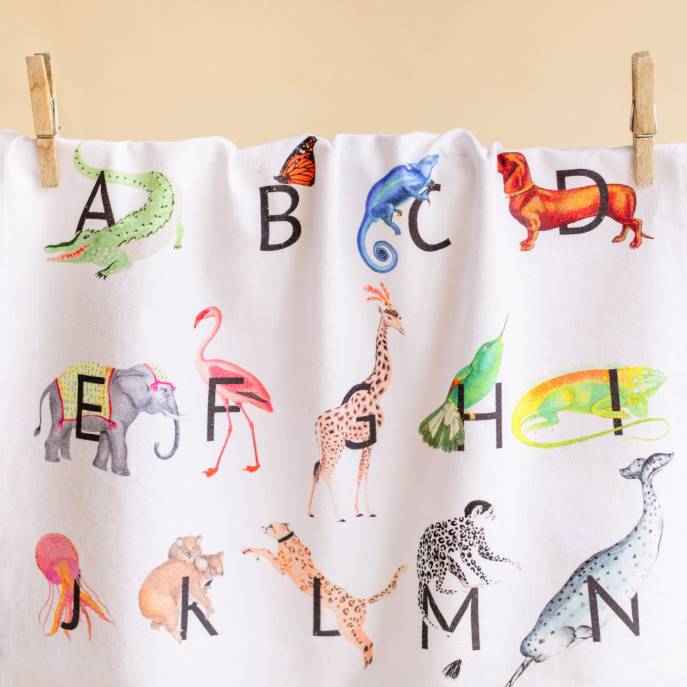 Alphabet tea towel pegged on a line