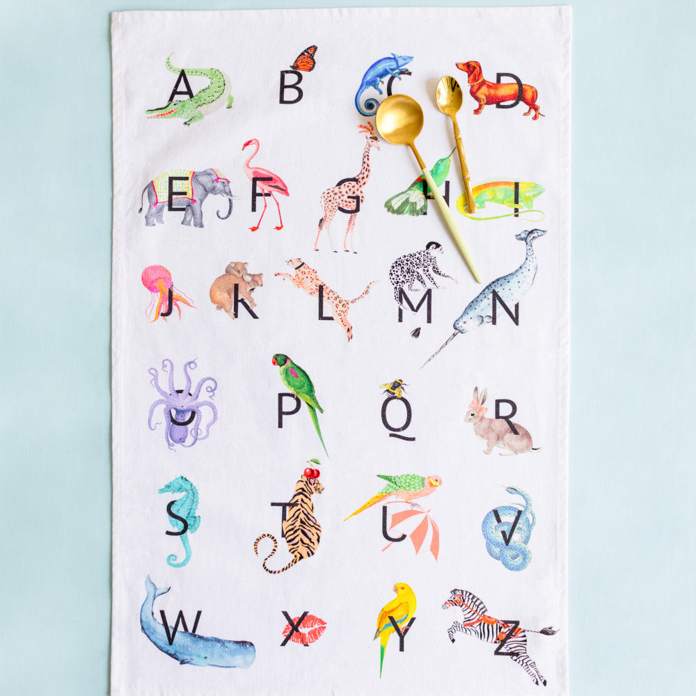 Alphabet tea towel with gold spoons