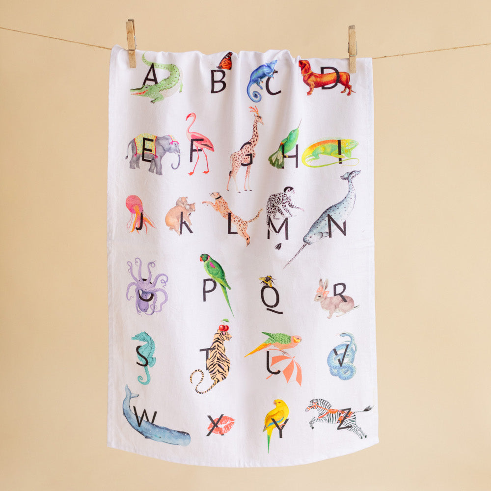 Alphabet tea towel pegged on a line