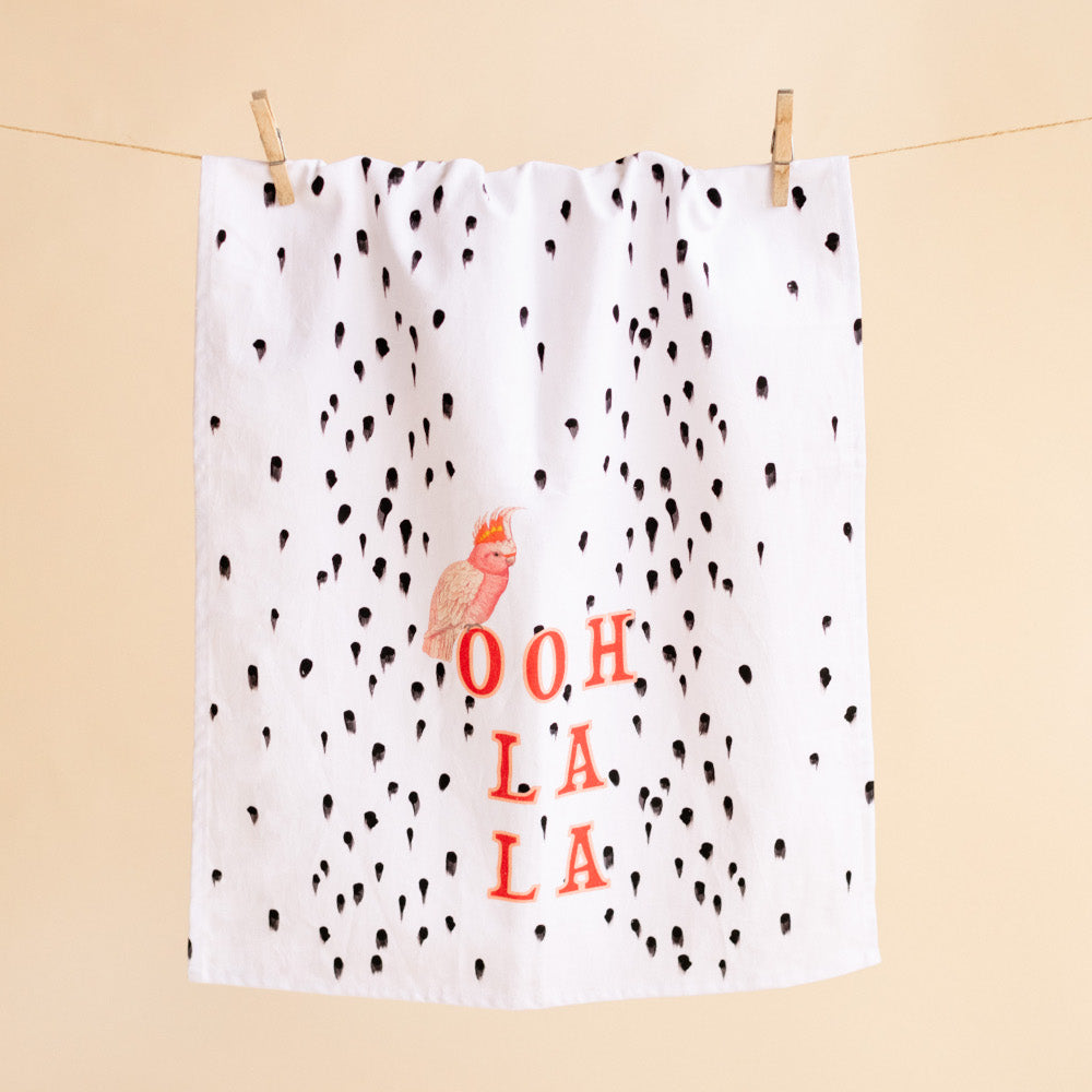 Ooh La La Tea Towel pegged on a line