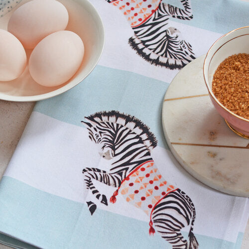 Zebra tea towel with bowl of eggs and brown sugar